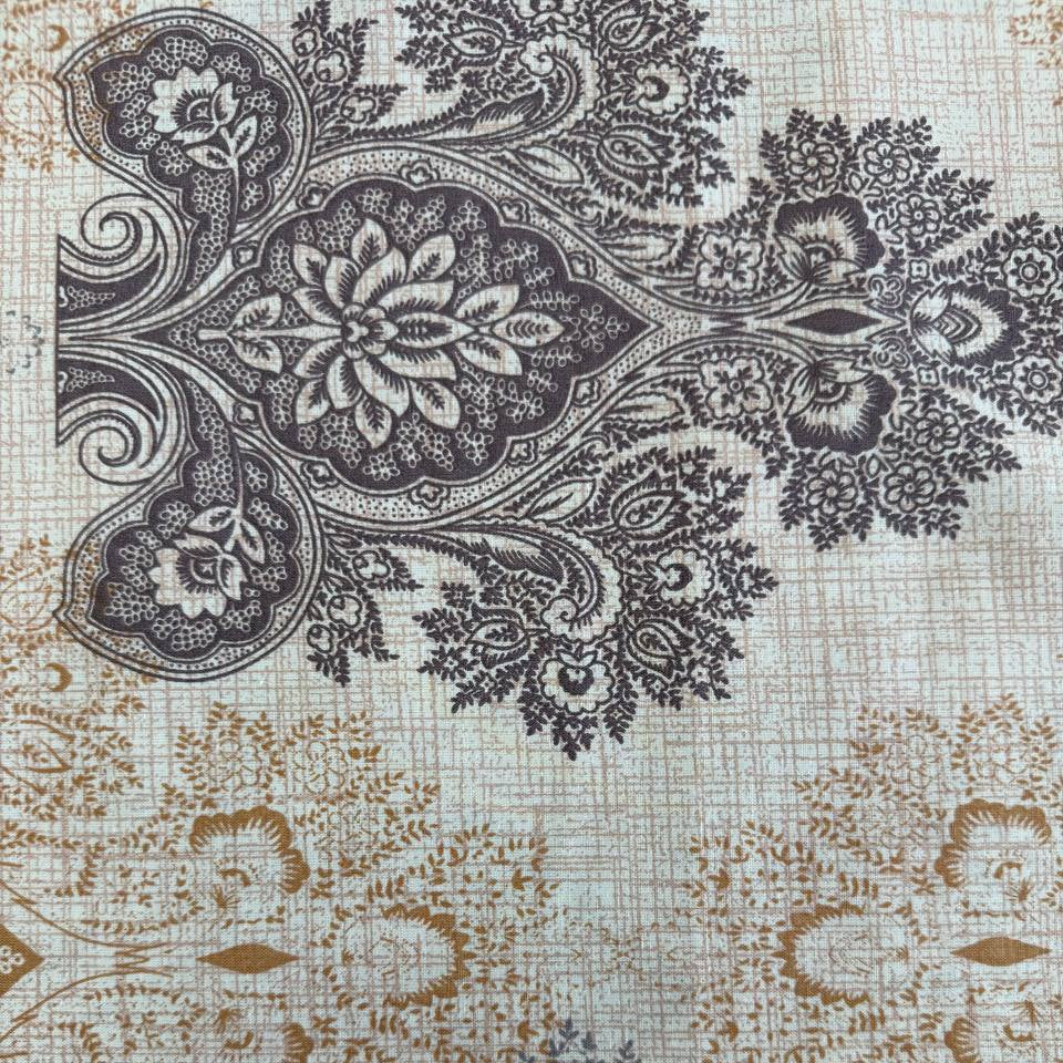 Vintage beige and grey medallion cotton sheeting fabric 108 inch wide folded stack