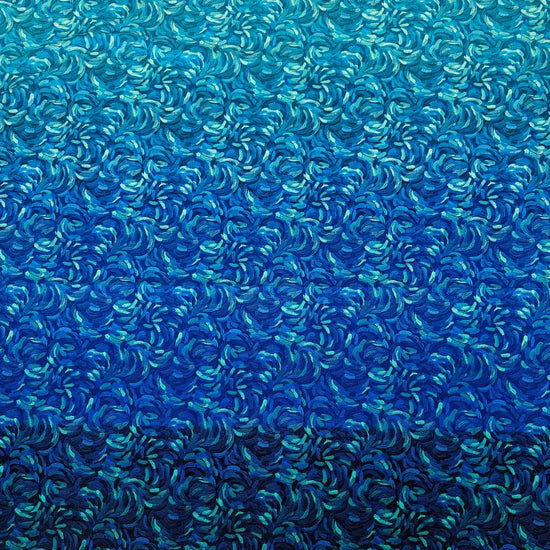 Northcott Starry Night dark blue multi ombre cotton fabric featuring swirling turquoise and royal blue brushstrokes fading into deep navy.