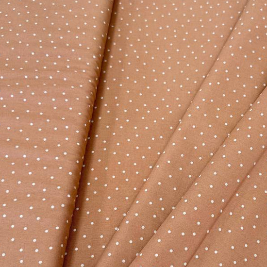 FIGO Fabrics Nest Dots 100% cotton fabric in Caramel and Rose colors with delicate white dotted pattern.