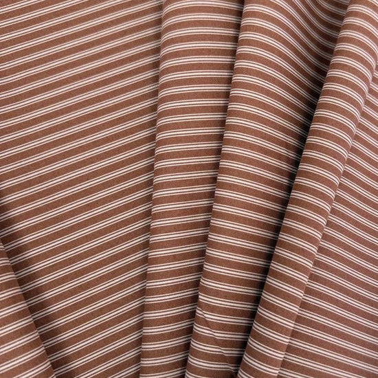 FIGO Fabrics Nest Stripe 100% cotton quilting fabric available in Aqua, Buttercream, and Cinnamon, featuring delicate white stripes.