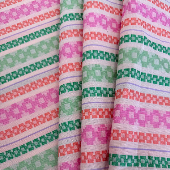 Anna Maria Textiles Journey Fruit 100% cotton fabric featuring colourful geometric stripes in pink, coral, mint green and lavender.