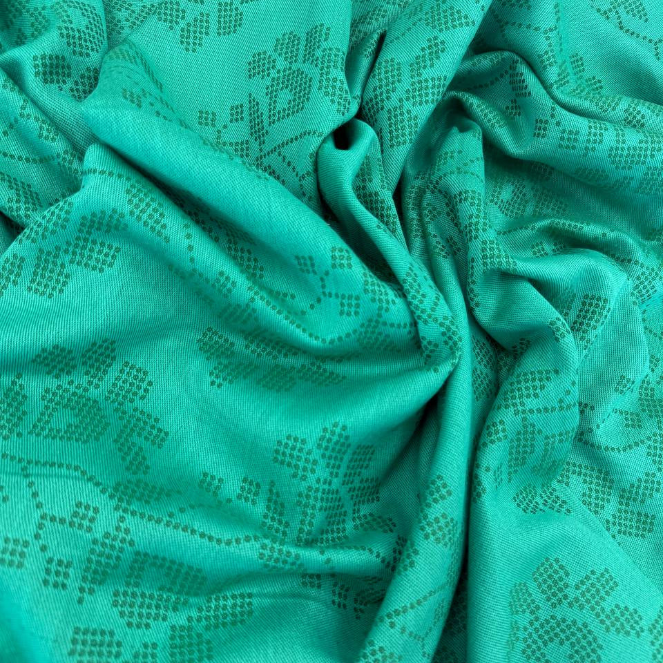 Journey by Anna Maria Textiles 100% cotton yarn-dyed fabric in Jam, Saffron, and Verdant colors with textured woven floral patterns.