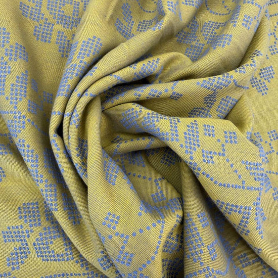 Journey by Anna Maria Textiles 100% cotton yarn-dyed fabric in Jam, Saffron, and Verdant colors with textured woven floral patterns.