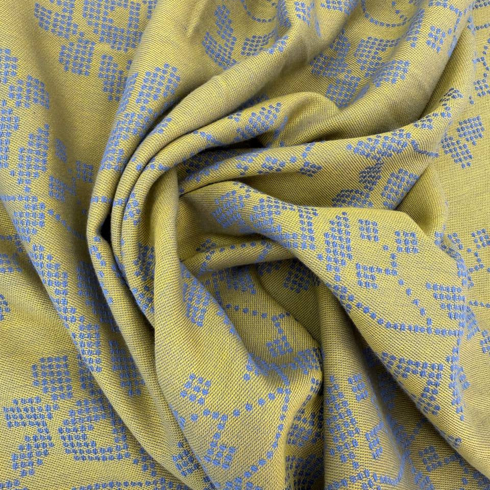 Journey by Anna Maria Textiles 100% cotton yarn-dyed fabric in Jam, Saffron, and Verdant colors with textured woven floral patterns.