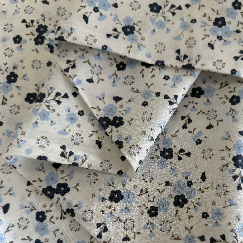 Blue floral cotton fabric by Moda Sun Drenched collection on cream background