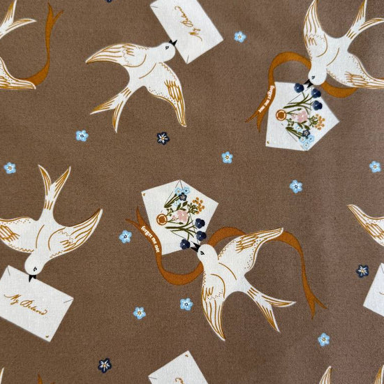 Bird print cotton fabric in teak brown with floral accents by Moda Enchantment collection