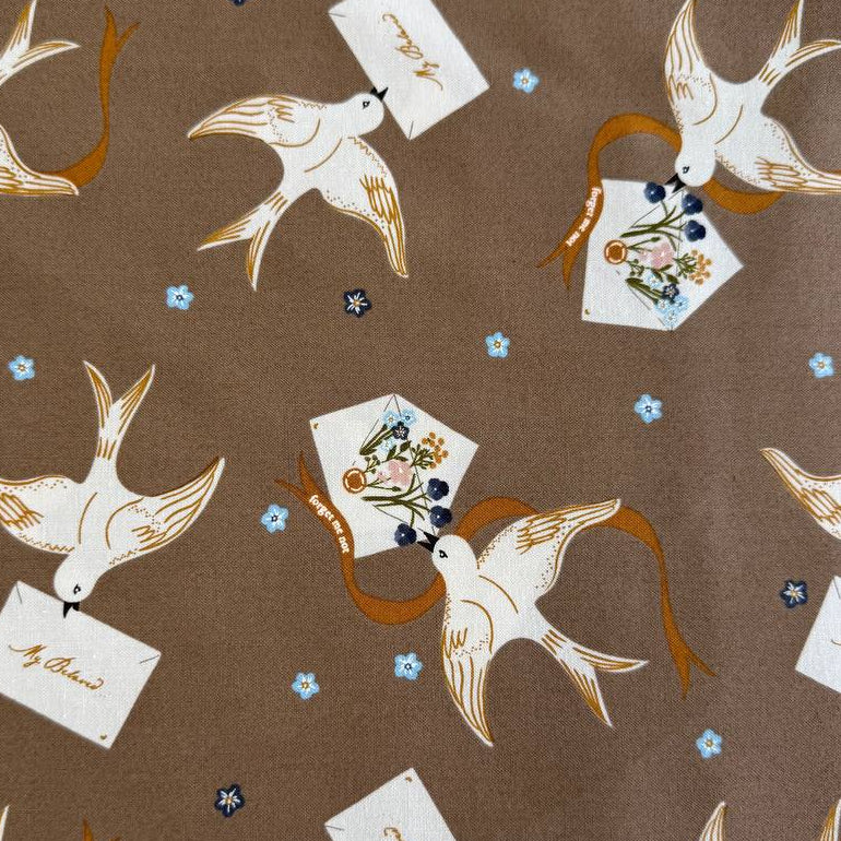Bird print cotton fabric in teak brown with floral accents by Moda Enchantment collection