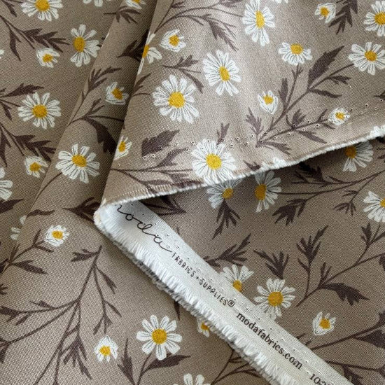 Beige cotton fabric with white daisy floral print
