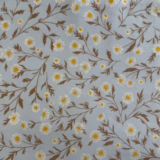 Blue cotton fabric with white daisy floral print