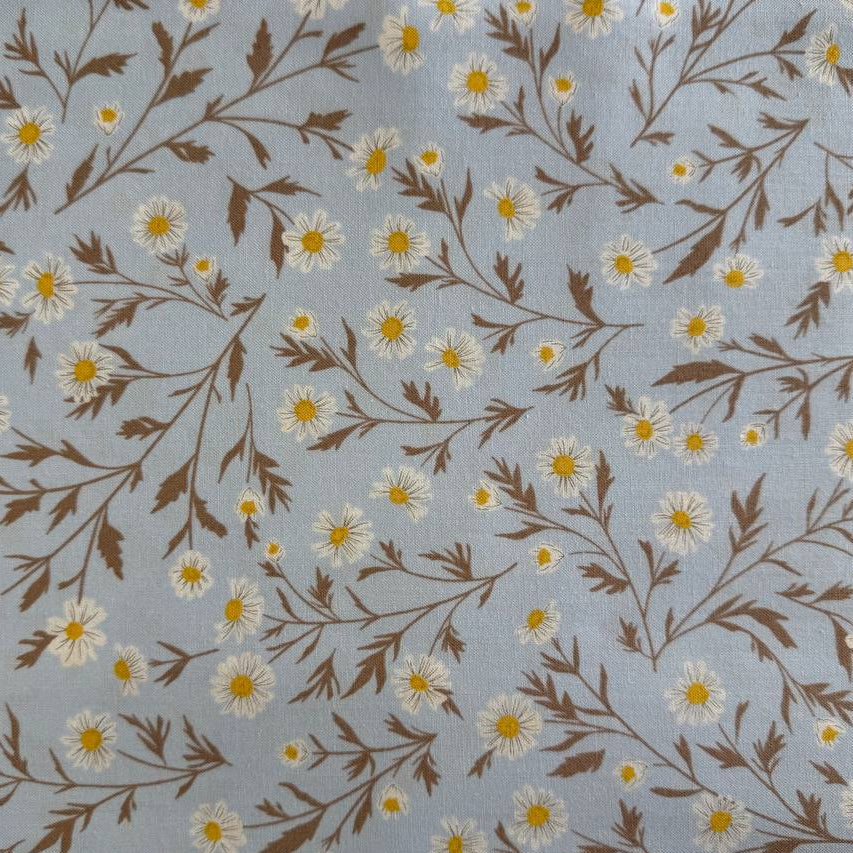 Blue cotton fabric with white daisy floral print