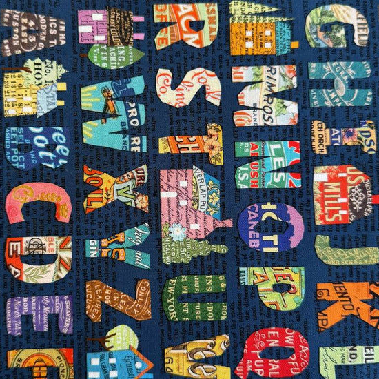 Moda Paper Hamlet alphabet cotton fabric dark background