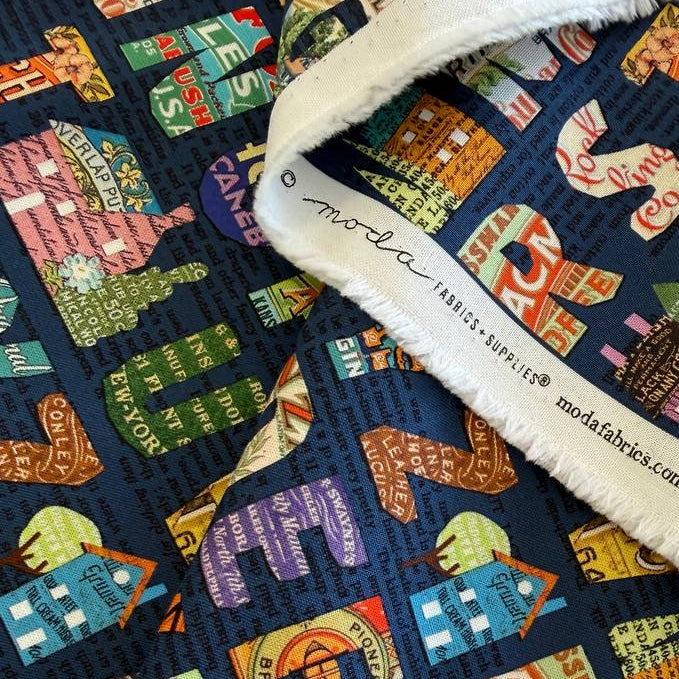 Moda Paper Hamlet alphabet cotton fabric dark background