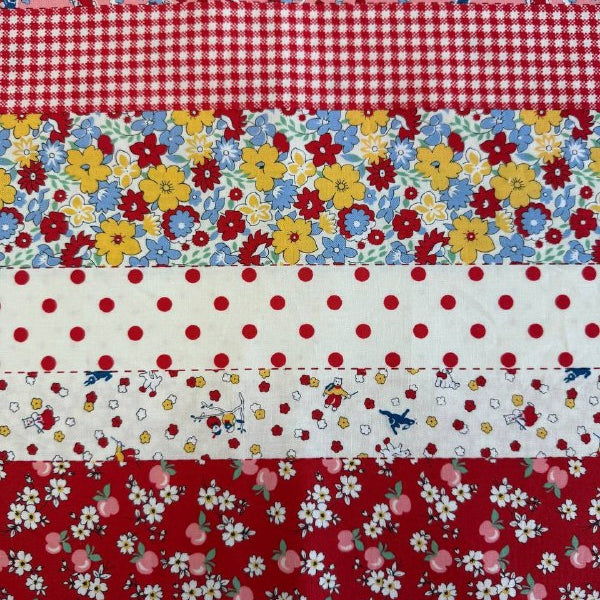 Vintage style patchwork stripe cotton fabric with florals, polka dots and gingham in red and pink tones from 30s Playtime collection by Moda