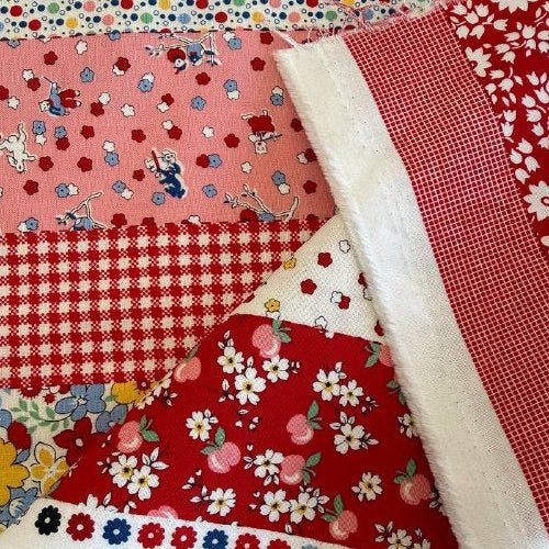 Vintage style patchwork stripe cotton fabric with florals, polka dots and gingham in red and pink tones from 30s Playtime collection by Moda