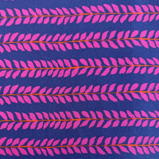 Navy cotton fabric with pink leaf pattern by Crystal Manning for Moda