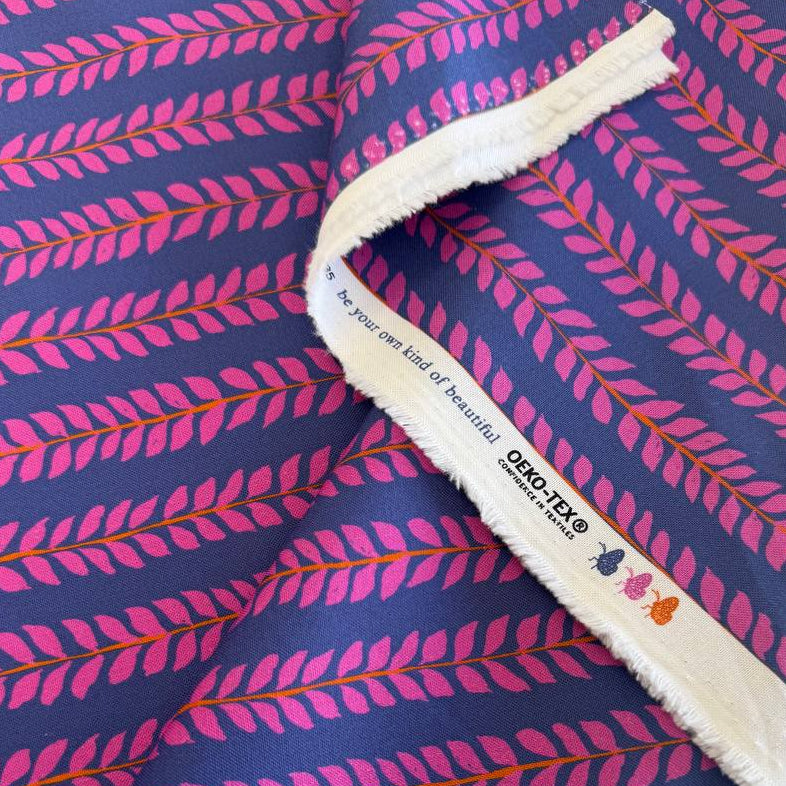 Navy cotton fabric with pink leaf pattern by Crystal Manning for Moda