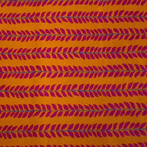 Mustard cotton fabric with pink leaf pattern by Crystal Manning for Moda