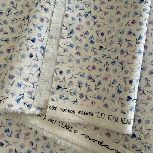 Delphinium floral cotton fabric by Janet Clare for Moda in ivory with delicate pastel floral print
