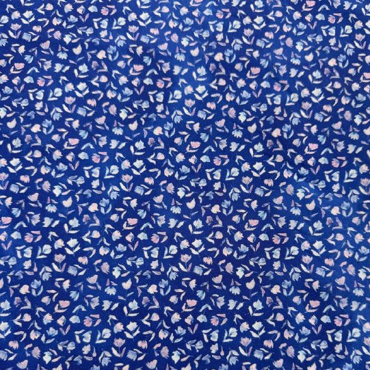 Delphinium floral cotton fabric by Janet Clare for Moda in deep blue with small pastel flowers