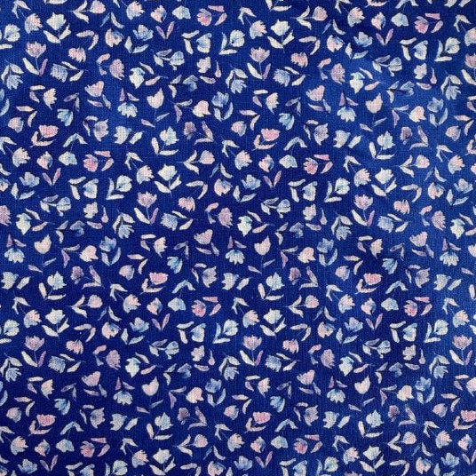 Delphinium floral cotton fabric by Janet Clare for Moda in deep blue with small pastel flowers