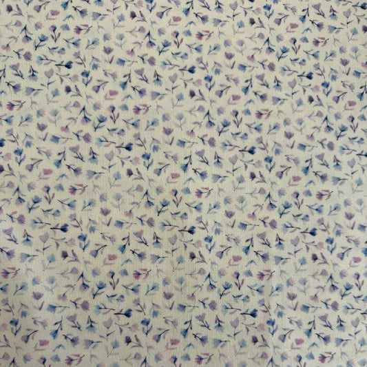 Delphinium floral cotton fabric by Janet Clare for Moda in ivory with delicate pastel floral print