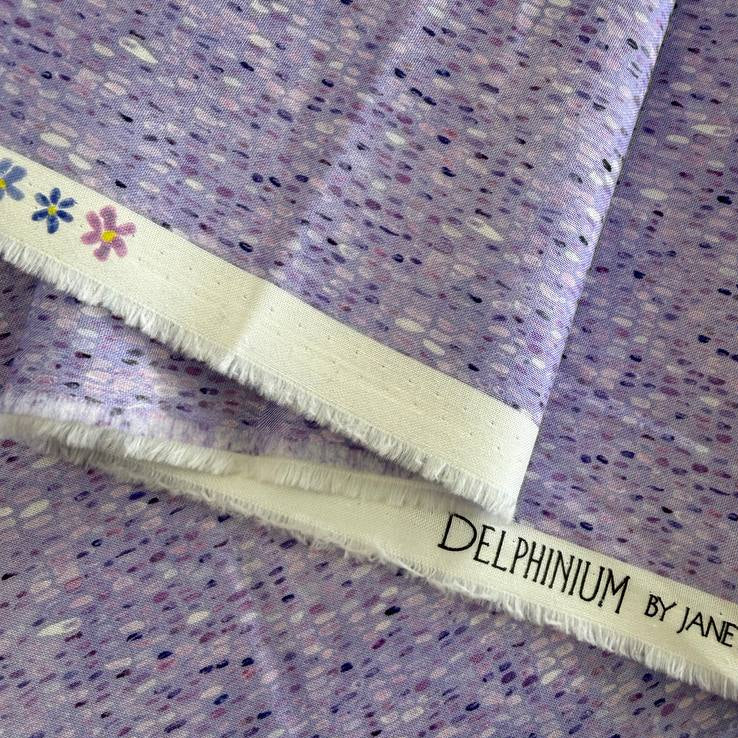 Delphinium Moda mauve quilting cotton fabric with soft textured dot pattern in lavender and purple tones