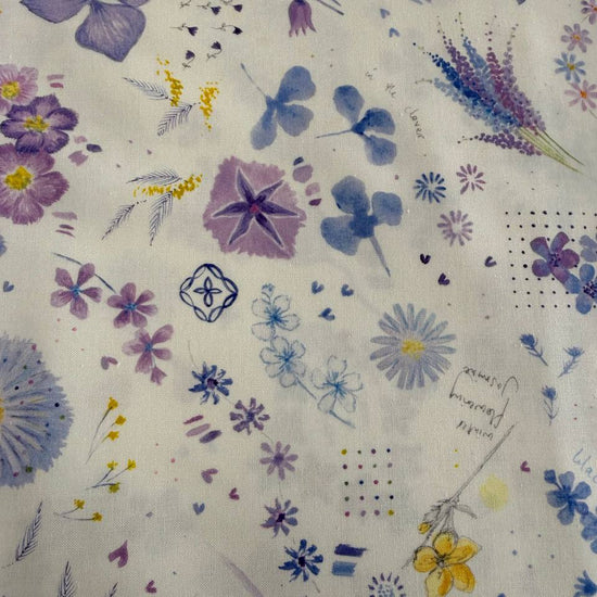 Delphinium Snowdrop floral cotton fabric by Jane Clare for Moda with soft purple and blue flowers on cream background