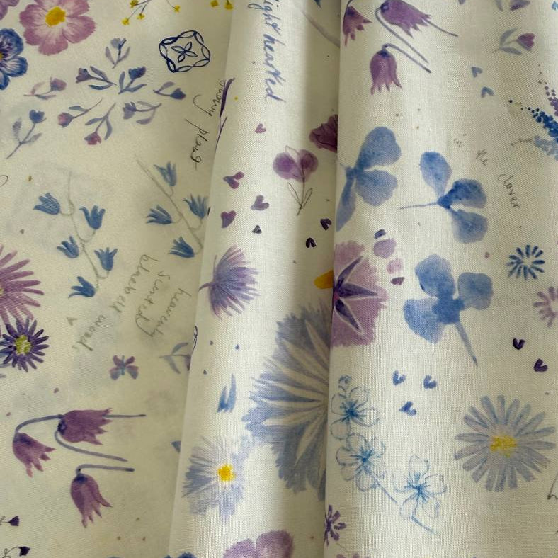 Delphinium Snowdrop floral cotton fabric by Jane Clare for Moda with soft purple and blue flowers on cream background