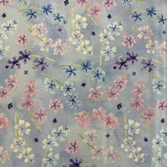 Delphinium Bluebell floral cotton fabric with pink and blue flowers on light blue background