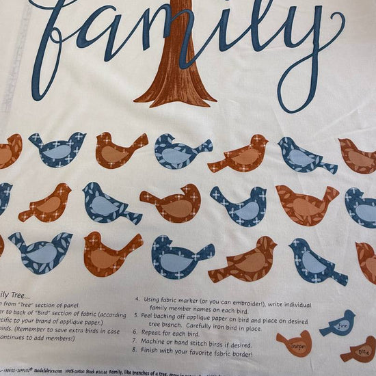 Light cream family tree fabric panel with birds and tree illustration