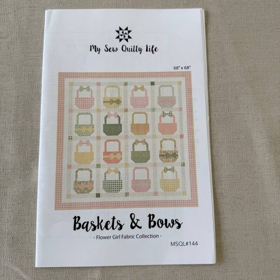 Baskets and Bows quilt pattern featuring pastel basket blocks with bows