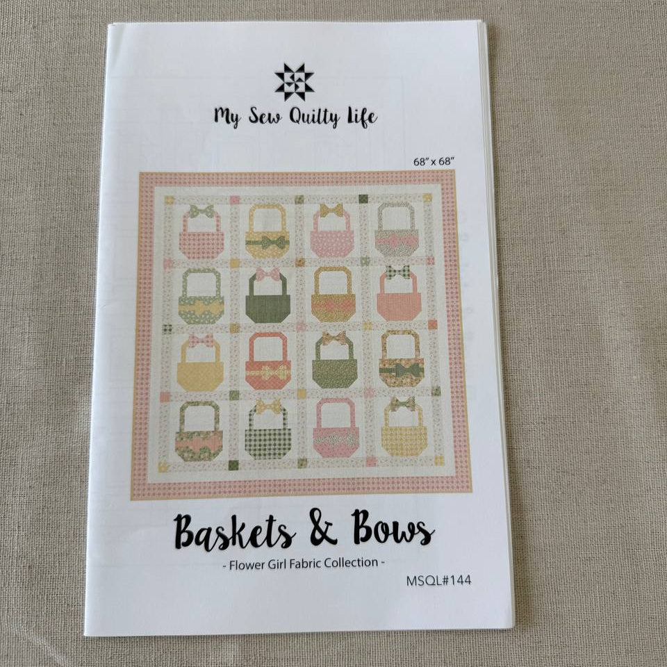 Baskets and Bows quilt pattern featuring pastel basket blocks with bows