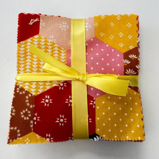 Honey charm pack quilting cotton squares in yellow pink and orange geometric patterns