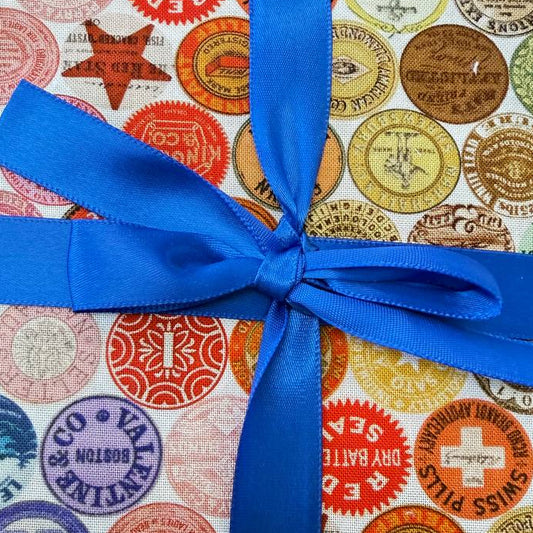 Curated In Color charm pack multicolor quilting cotton squares with vintage stamp prints

