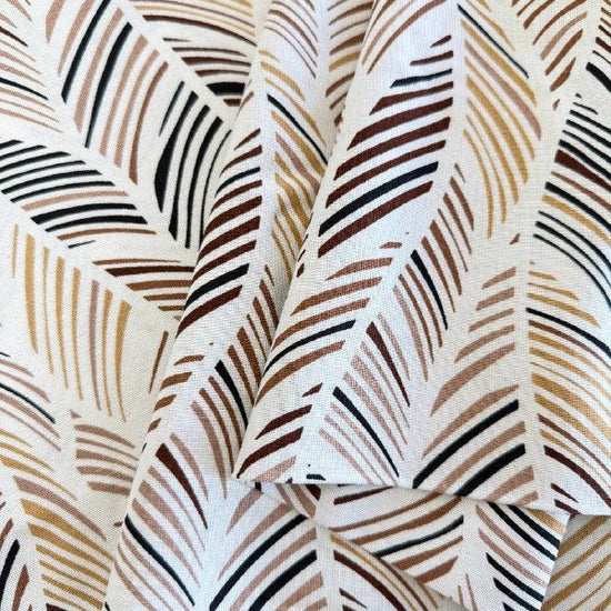 Palm print fabric in brown multi tones on linen rayon blend