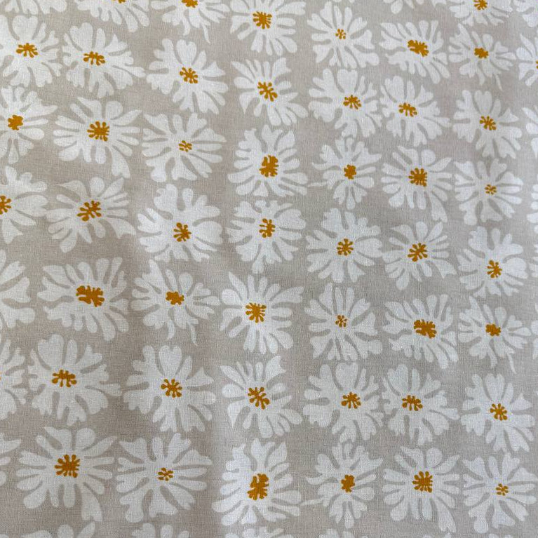 Beige linen fabric with white floral print and mustard accents by Moda Urban Whisper Zen Chic