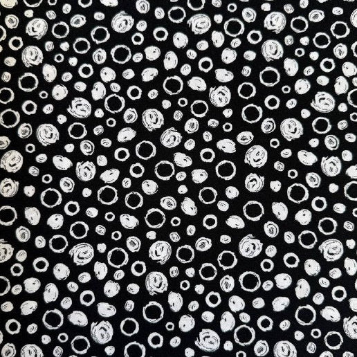 Black and white cotton fabric with abstract scribble dot pattern