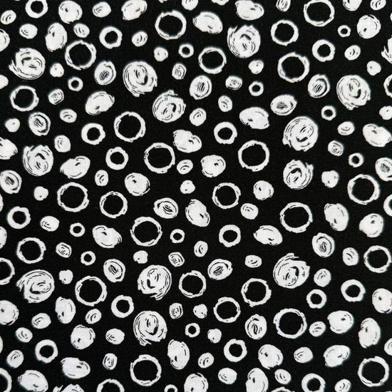 Black and white cotton fabric with abstract scribble dot pattern