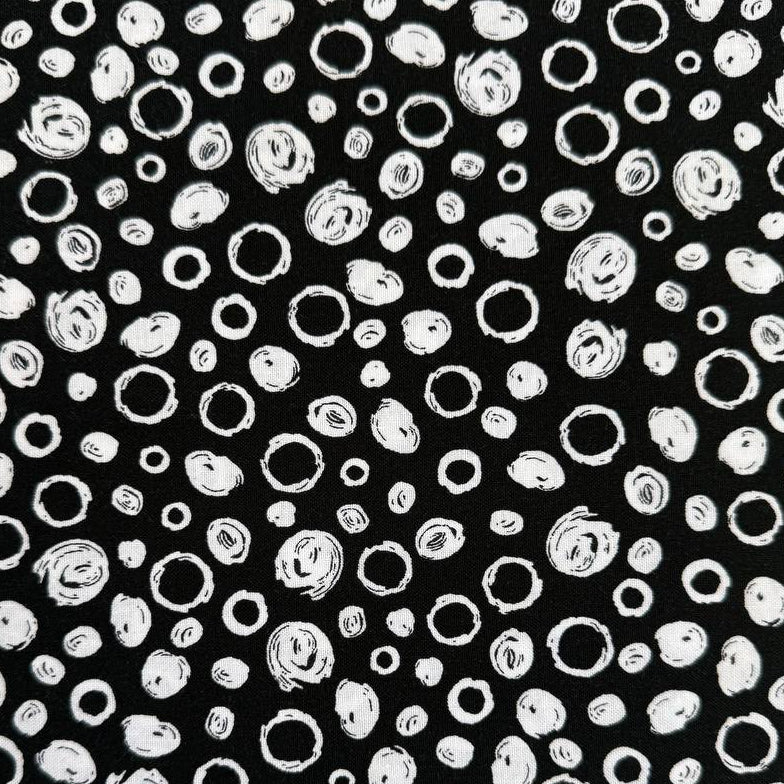 Black and white cotton fabric with abstract scribble dot pattern