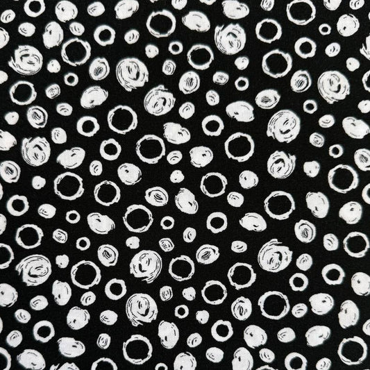 Black and white cotton fabric with abstract scribble dot pattern