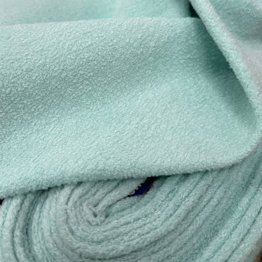 This ultra-soft Fireside fleece features a plush, cozy surface with a gentle texture and a fresh Ocean Spray mint tone.