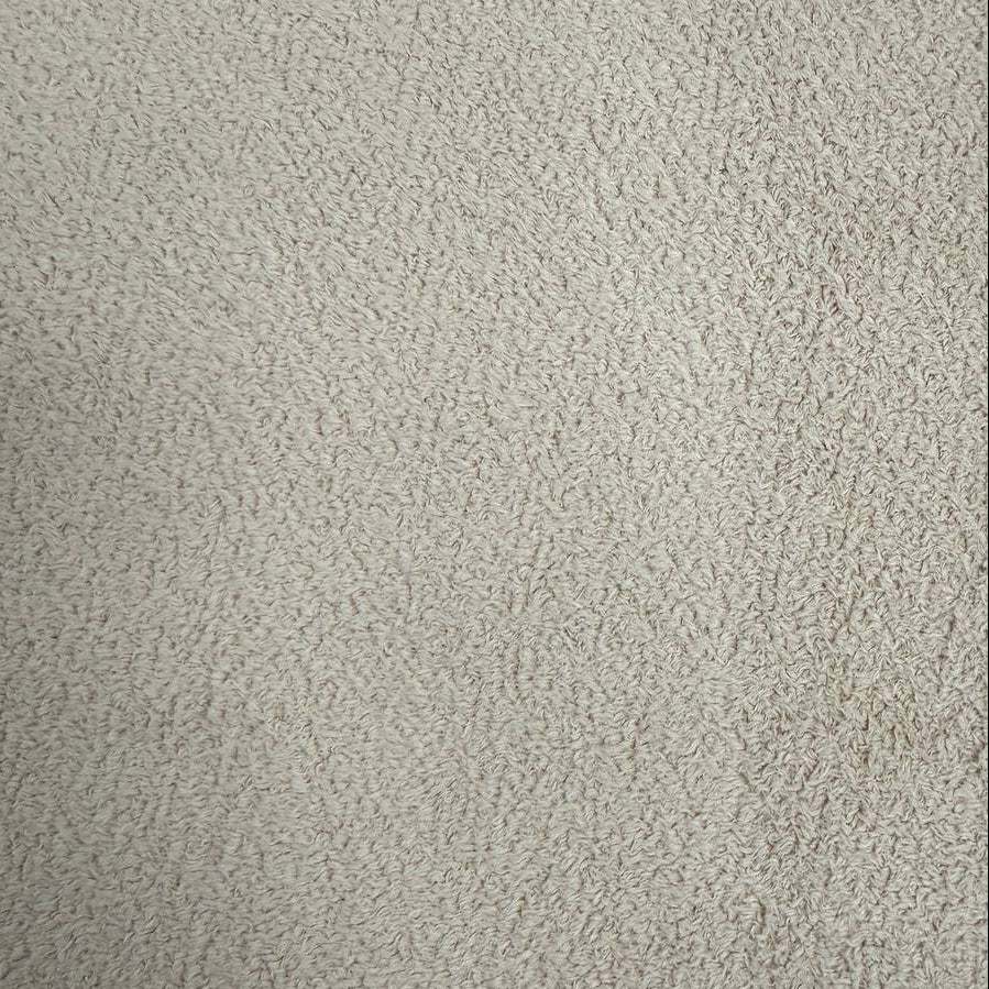Natural beige sherpa fleece fabric with soft plush texture