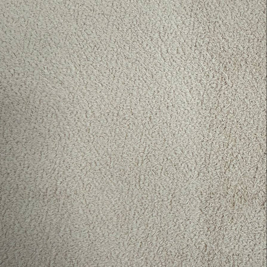 Natural beige sherpa fleece fabric with soft plush texture