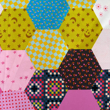 Catnap 108 inch patchwork cotton fabric with colorful geometric and star patterns
