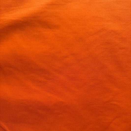 Orange solid broadcloth fabric, polyester cotton blend, smooth matte finish 