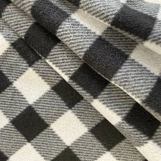 Soft and warm polar fleece fabric with a classic buffalo plaid stripe pattern in grey tones.