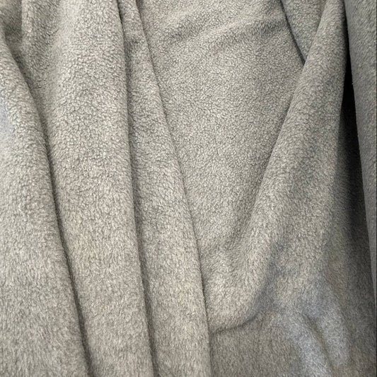 Soft and warm polar fleece fabric in a light grey melange color.