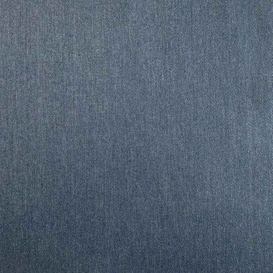 Denim blue stretch denim fabric folded showing smooth woven texture