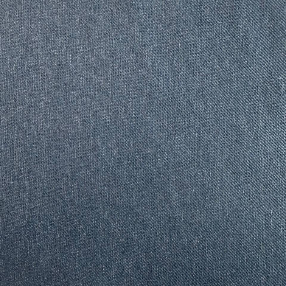 Denim blue stretch denim fabric folded showing smooth woven texture