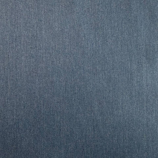 Denim blue stretch denim fabric folded showing smooth woven texture